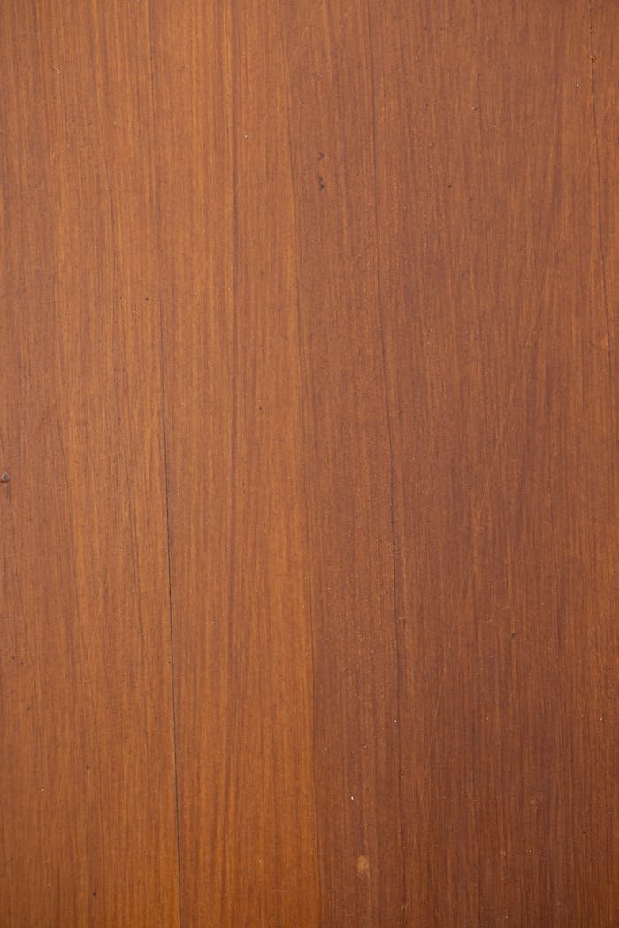 A high-resolution close-up of a natural wooden surface showcasing its grain and texture.